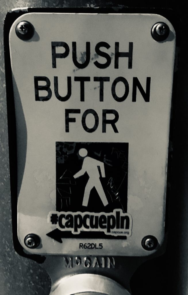 Crosswalk sign with CapCUE sticker